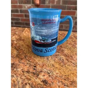 Coffee cup Peggy's Cove Lighthouse in Nova Scotia, Canada.